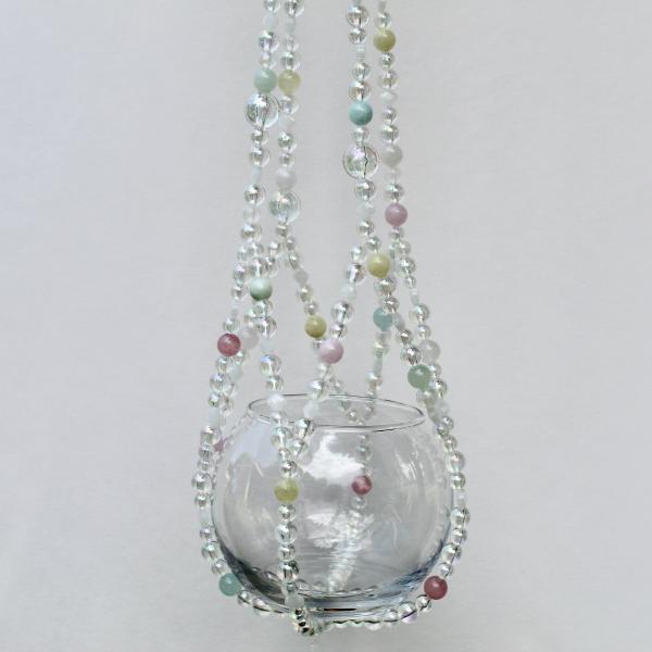 The complete Sugar Cloud beaded plant hanger, a whimsical piece with a dreamy pastel color palette.